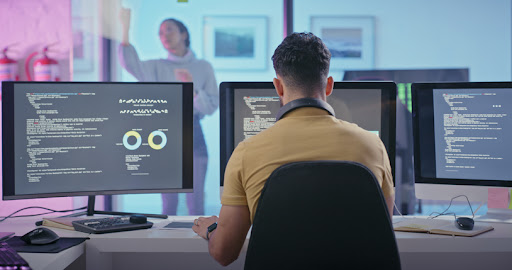 Coding, programming and software engineer man on computer screen, monitor and database with code design. Information technology, digital innovation and developer with system or server analytics data