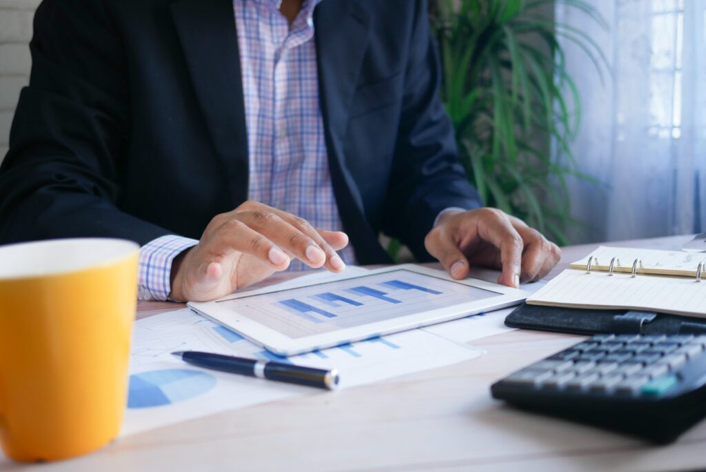man sitting at desk on 6 Industries Embracing Data-Driven Decision Making in 2022